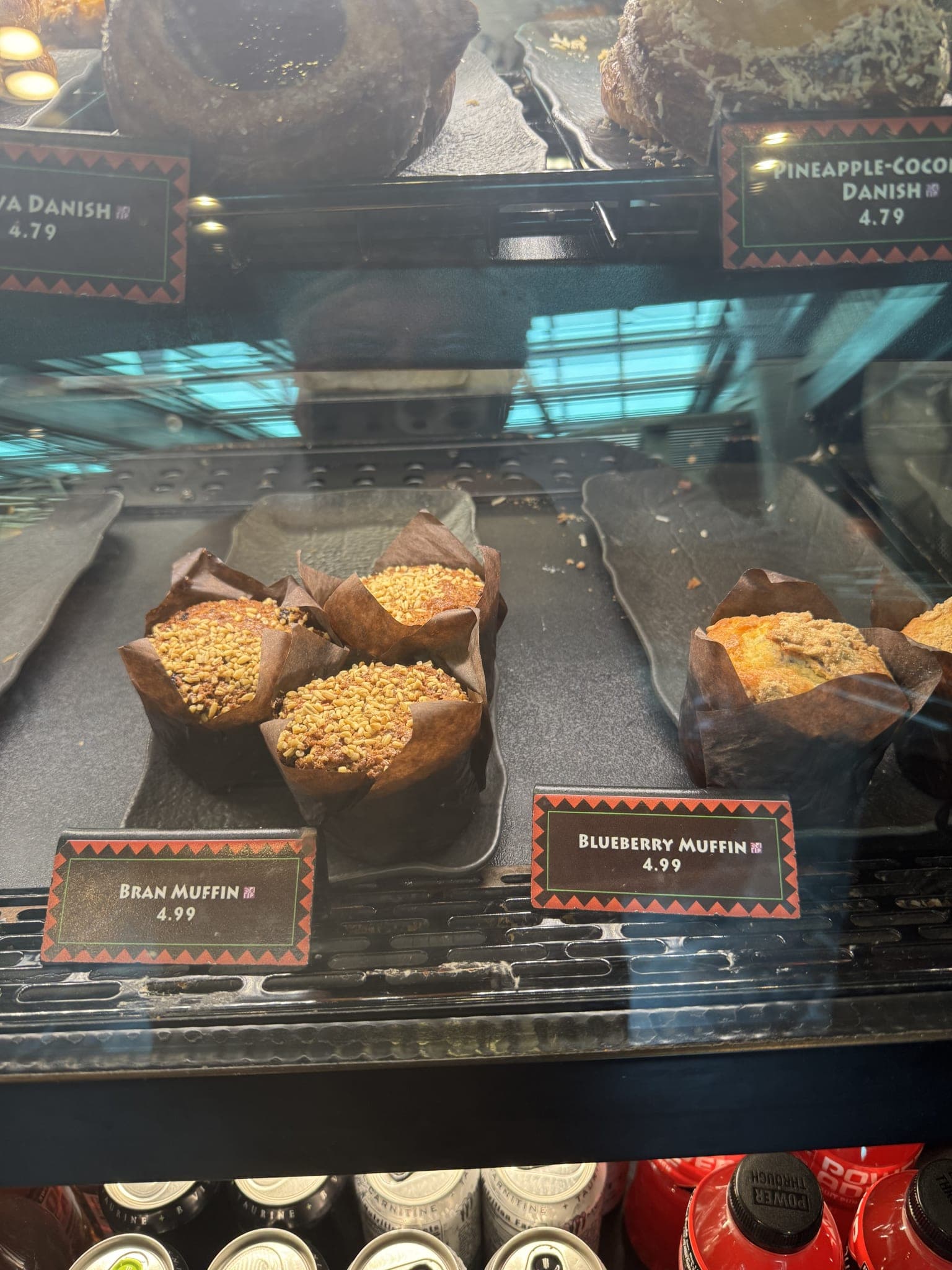 Kona Island pastry case with bran muffins and danish