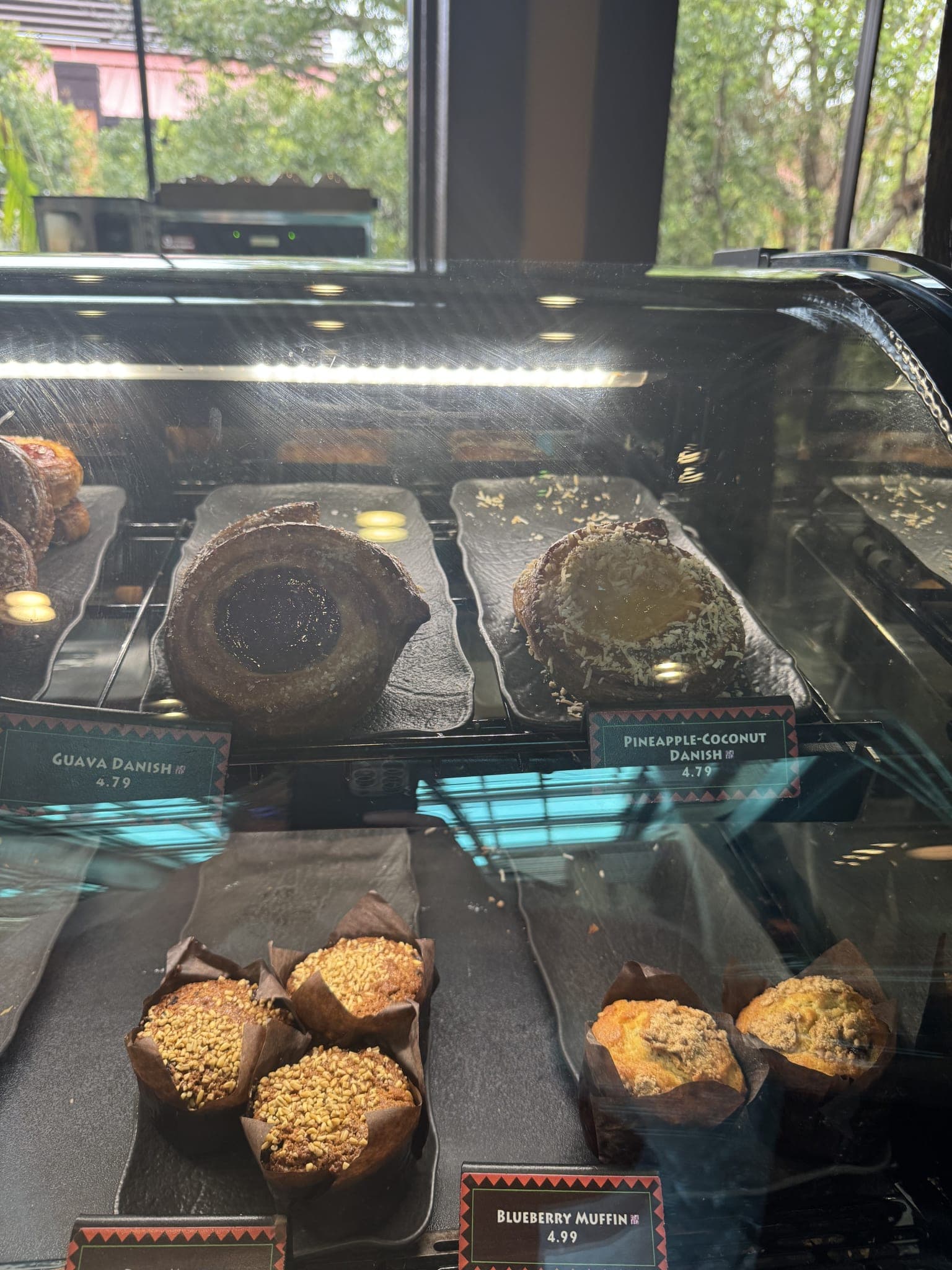 Guava and pineapple-coconut danish in the display case