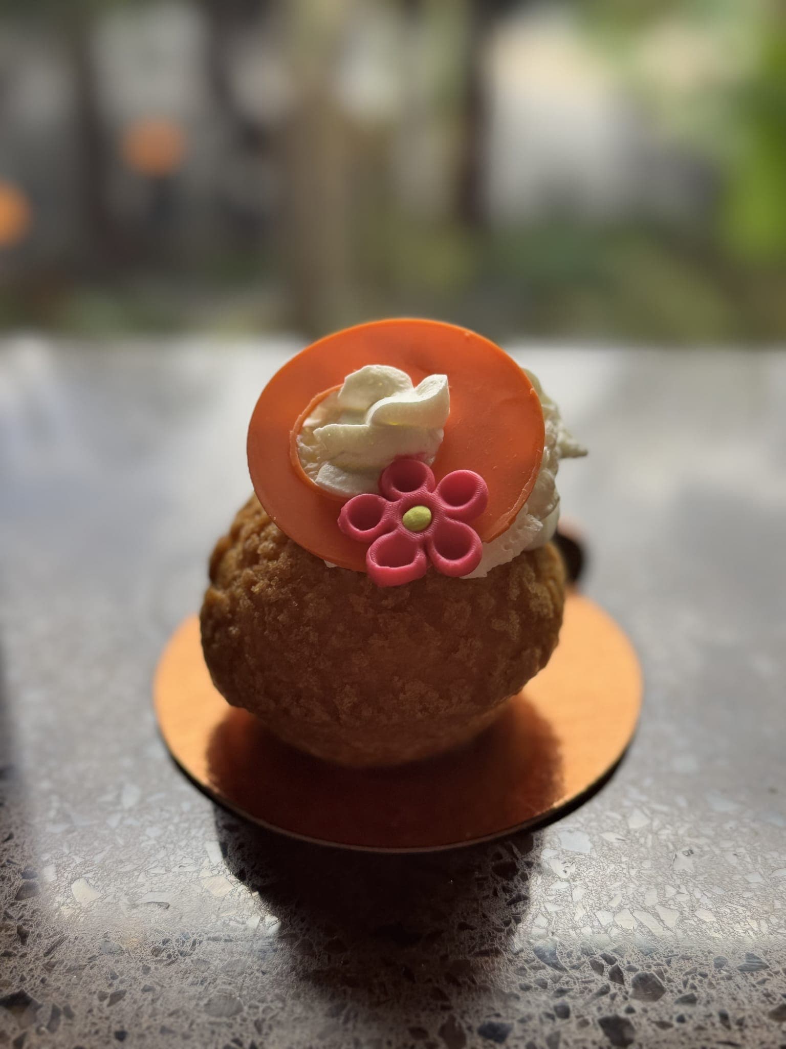 Coconut-pineapple choux close-up on the counter